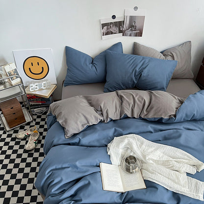 Light grey washed cotton bedding set made up on a bed
