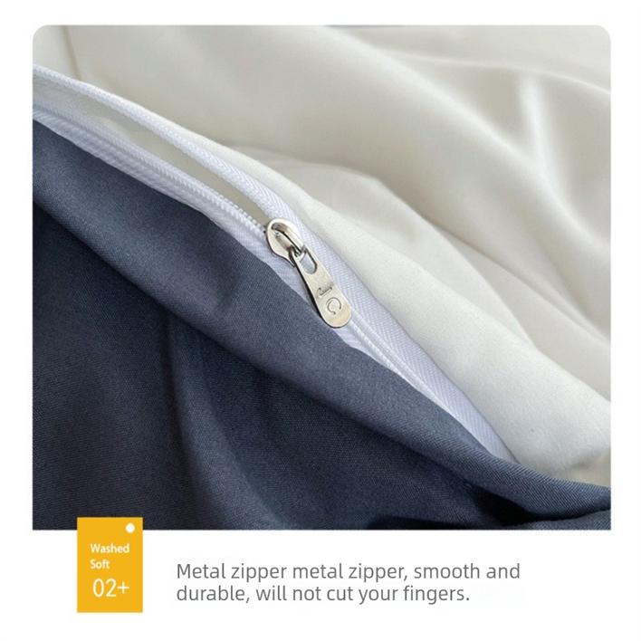 Light grey washed cotton bedding set made up on a bed