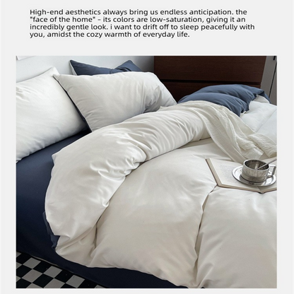 Light grey washed cotton bedding set made up on a bed