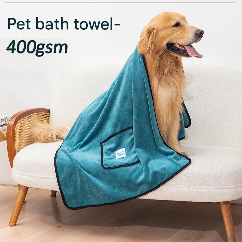 Dog rain gear set with grey raincoat, yellow boots and grey towel