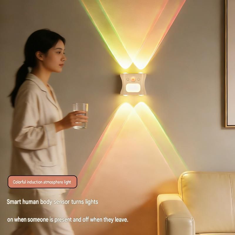 Black rechargeable motion sensor wall lights mounted along a hallway