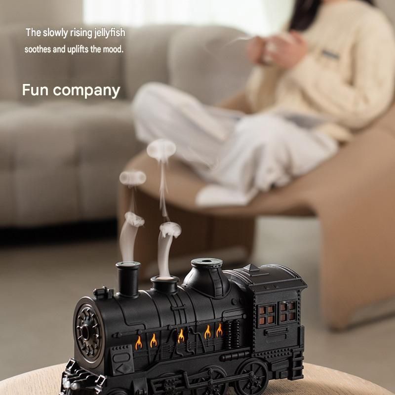 Brass-coloured retro train humidifier with cordless UV mite remover vacuum
