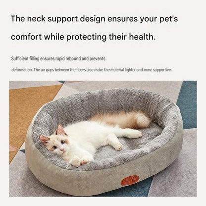 Beige quilted dog vest with leash ring beside a coffee-coloured oval fleece pet bed