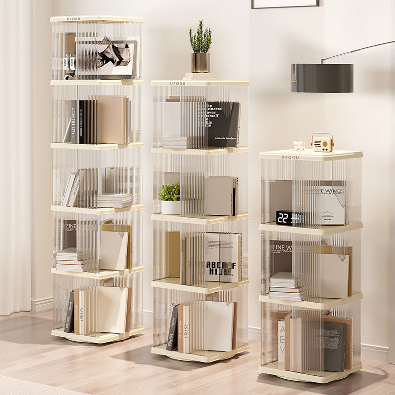 Cream white square rotating bookshelf with two tiers holding books