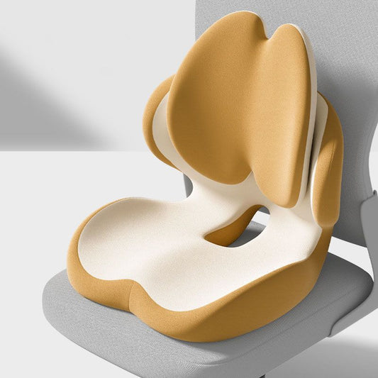 Yellow memory foam seat cushion with integrated lumbar support on a chair
