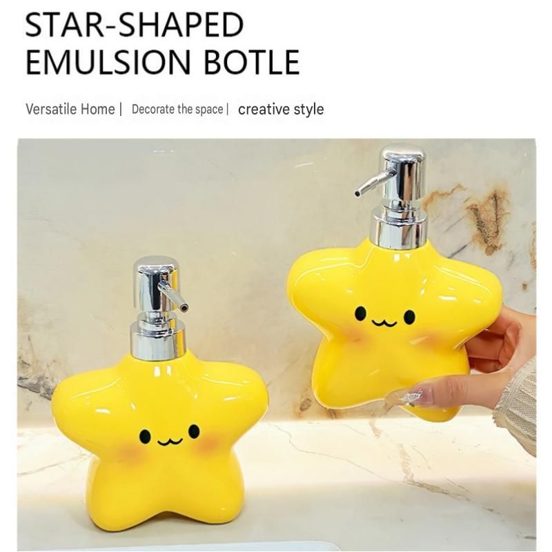 Yellow star bathroom set with plastic toothbrush holder and two ceramic pump bottles