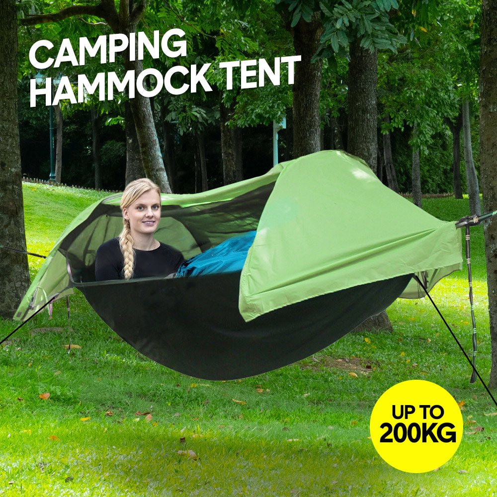 Double camping hammock tent with mosquito net strung between two trees