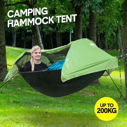 Double camping hammock tent with mosquito net strung between two trees