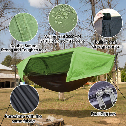 Double camping hammock tent with mosquito net strung between two trees