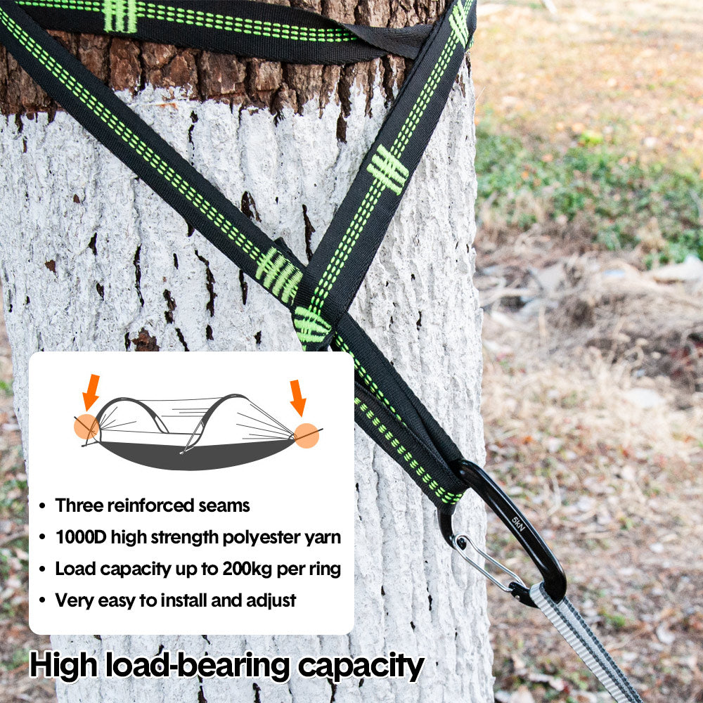 Double camping hammock tent with mosquito net strung between two trees