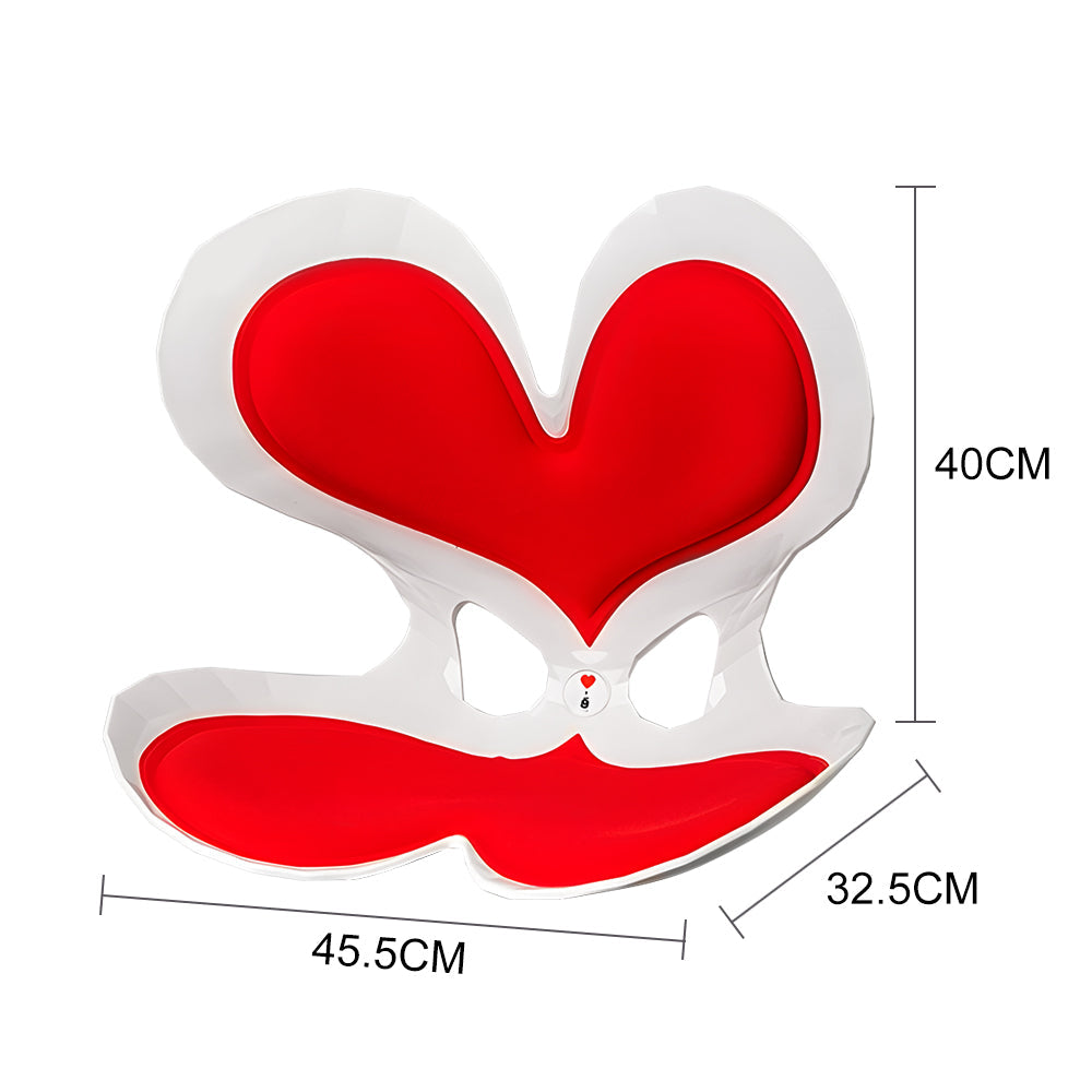 Red heart-shaped ergonomic seat with contoured back and seat support
